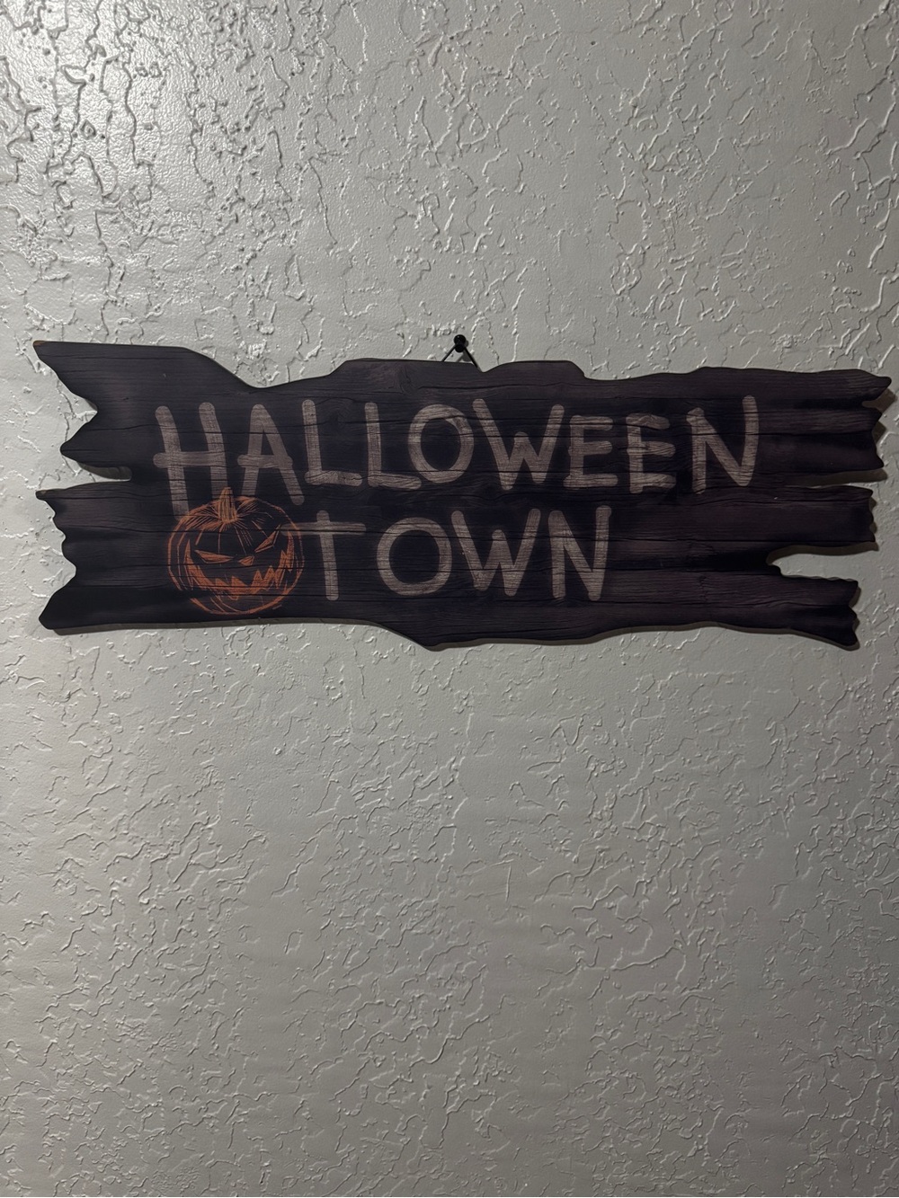 The Nightmare Before Christmas Halloween Town Faux Wood Sign from Hot Topic